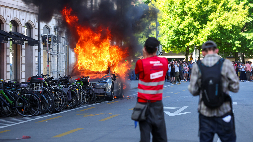 Protesters Torch Tesla and Vandalize UN Office in Fiery Anti-G7 Rally